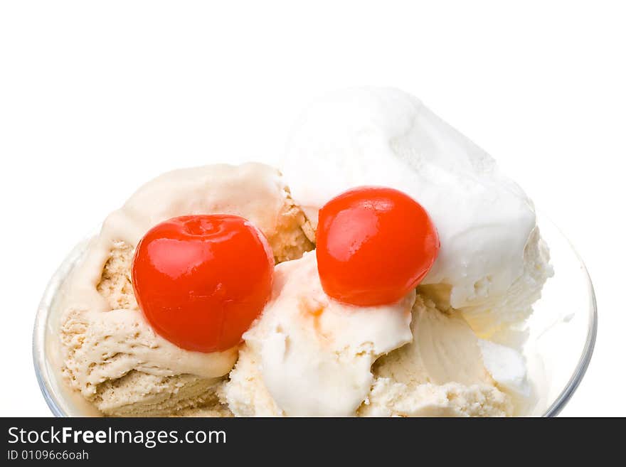 Ice-cream with a cherry in a glass on a white background. Ice-cream with a cherry in a glass on a white background.