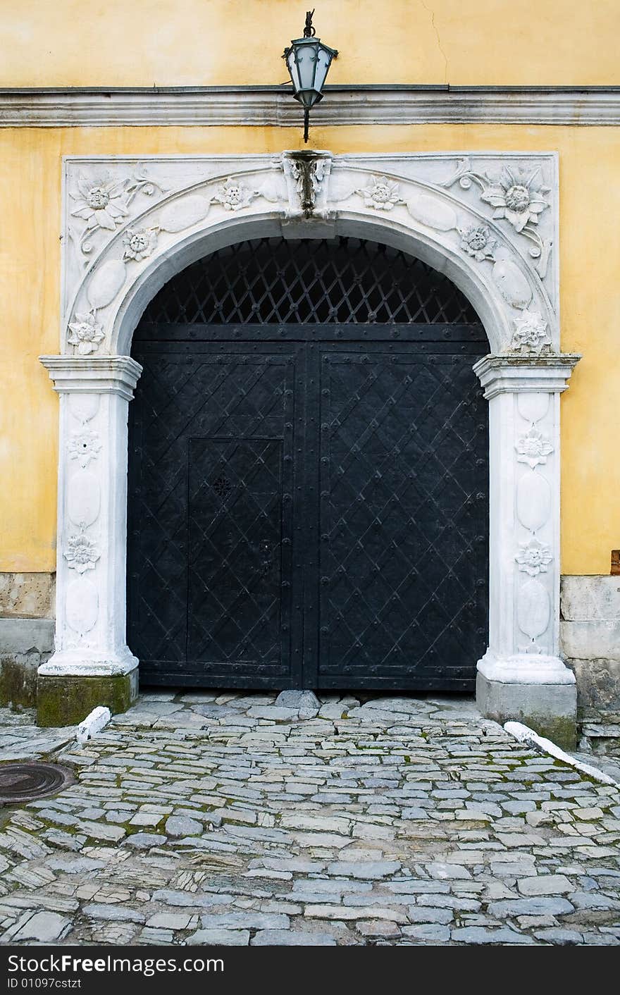 An image of a black iron door