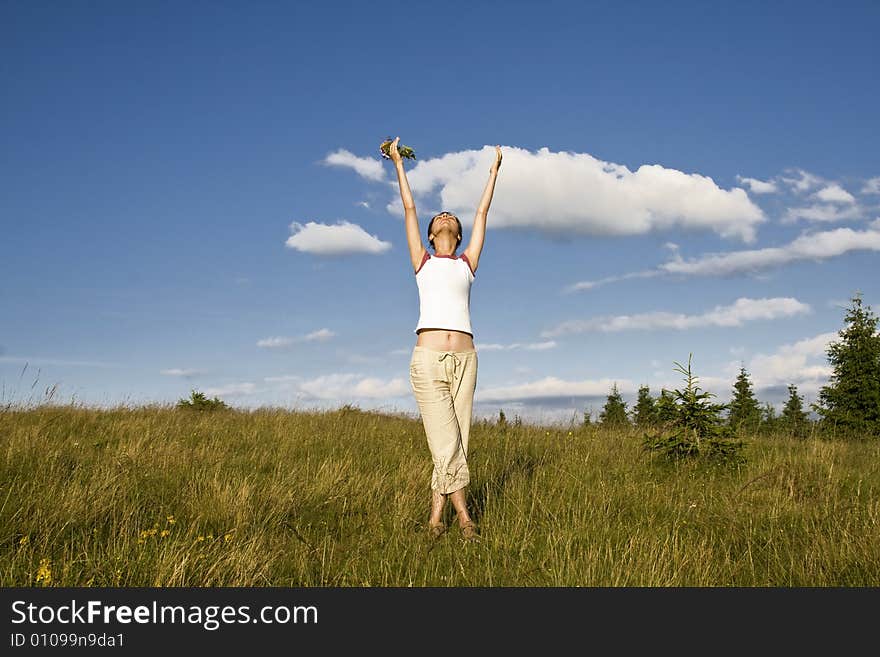 Young woman in summer field