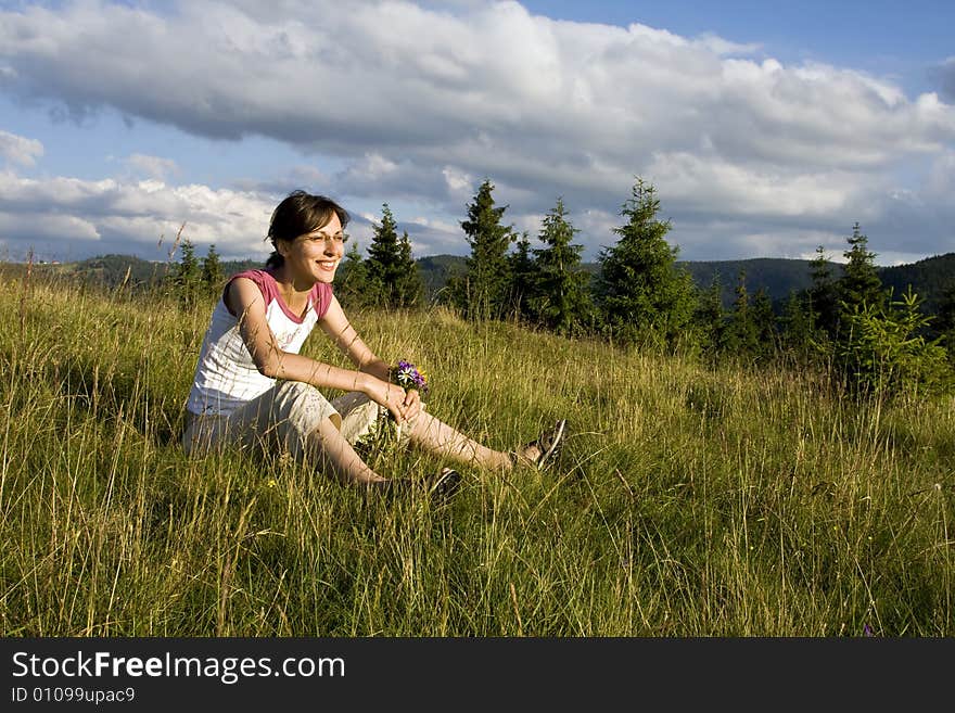 Young woman in summer field