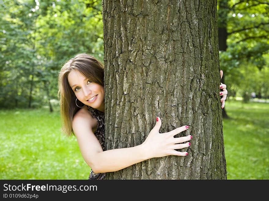 Happy Beautiful Woman Relaxing In The Park