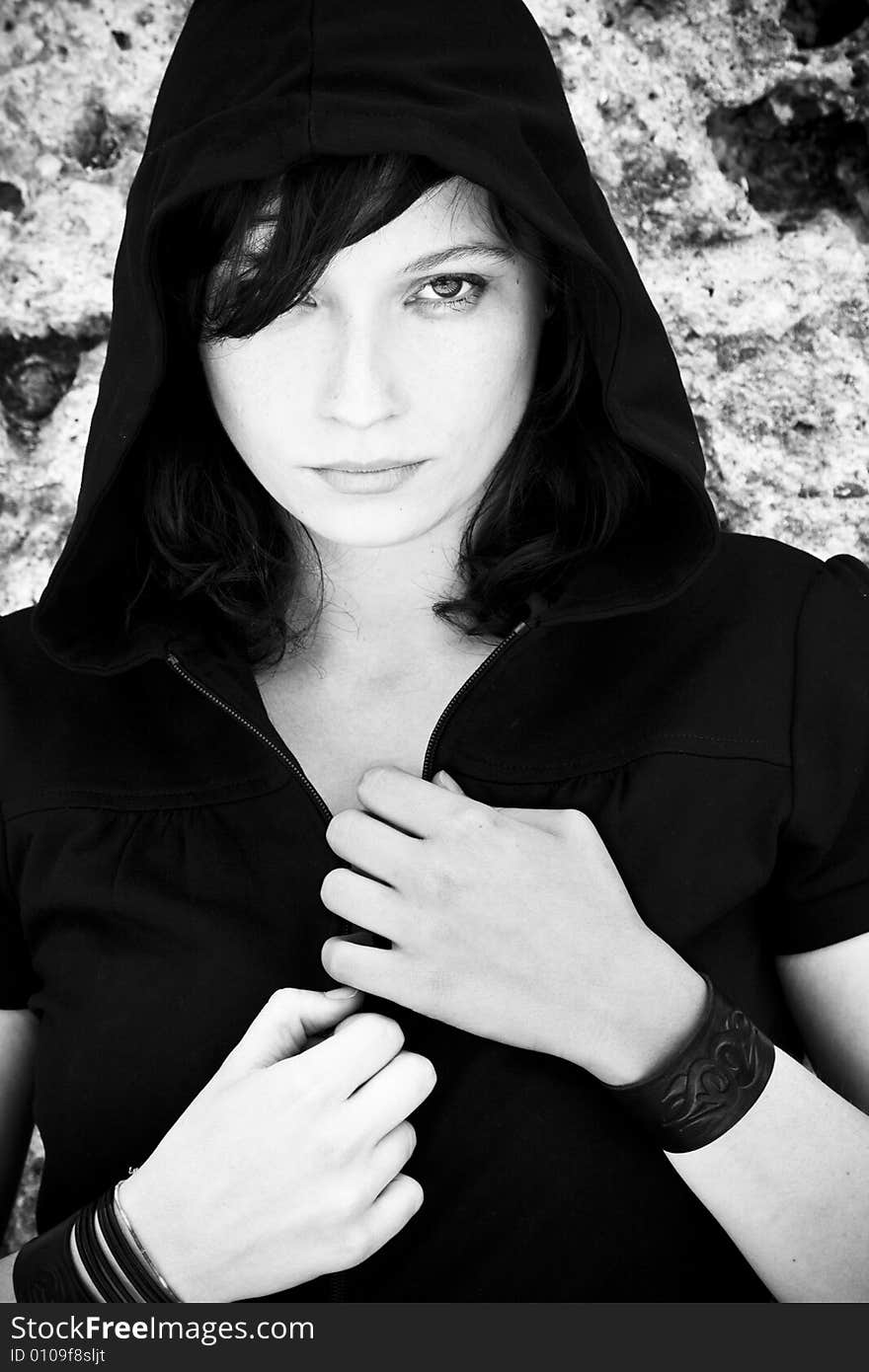 Young woman staring at camera, high contrasted black and white. Young woman staring at camera, high contrasted black and white.