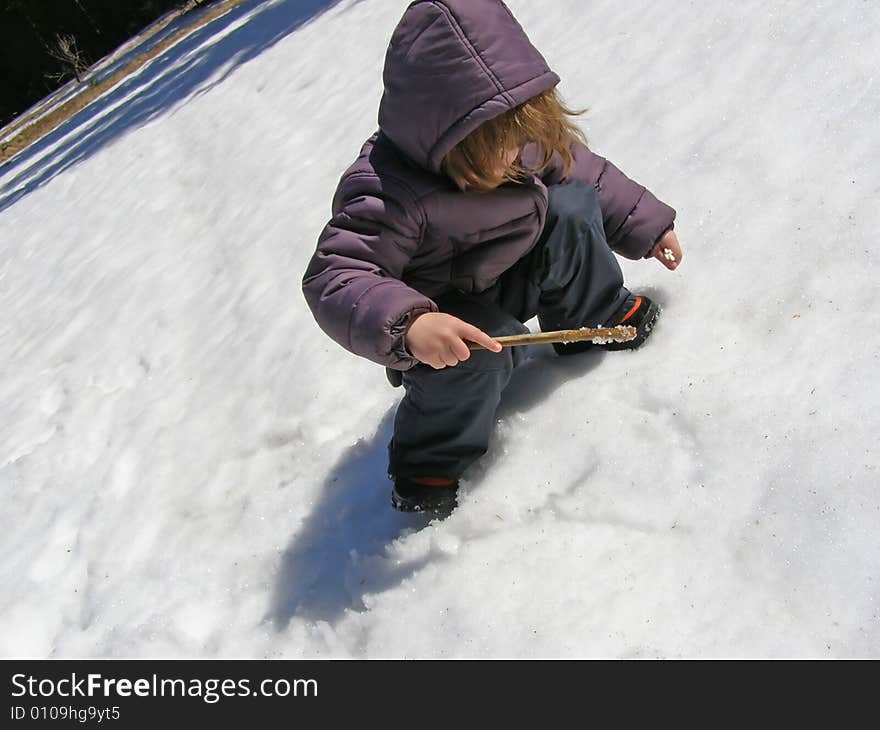 Child playing in the snow