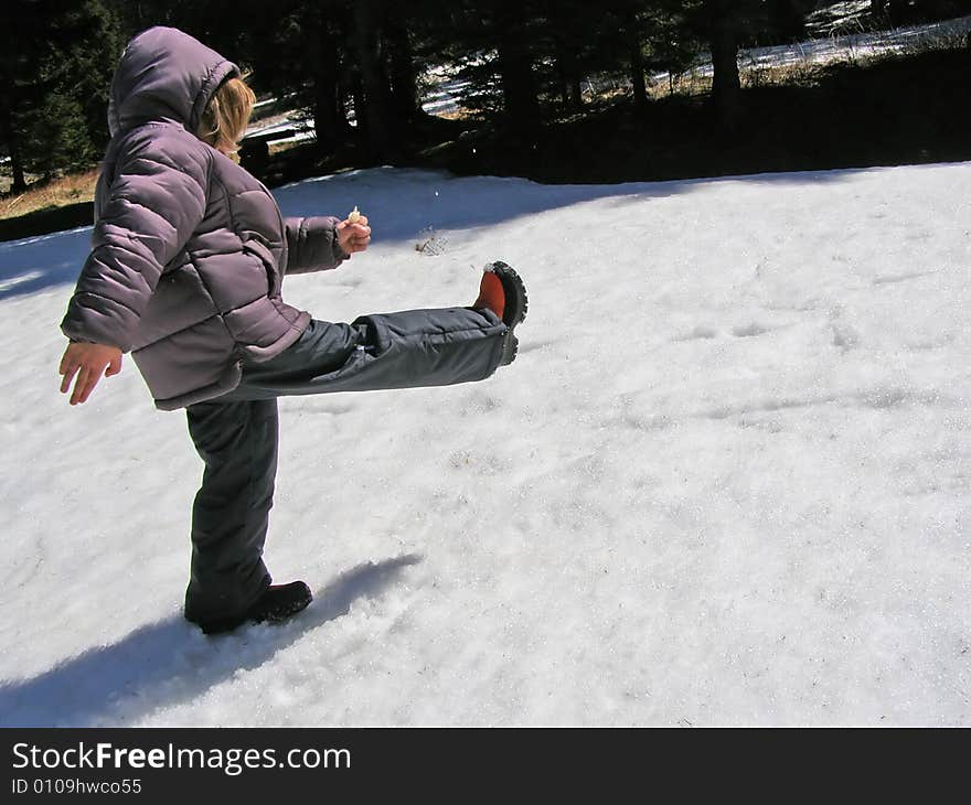 Child playing in the snow