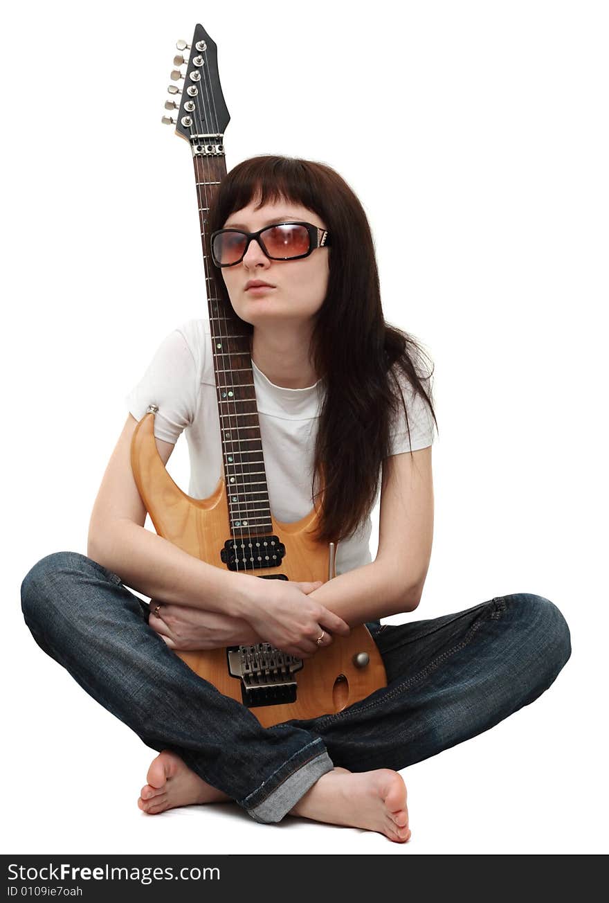 Pretty girl holding an electric guitar isolated on white background