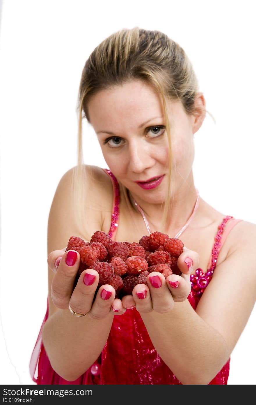 Long hair blonde woman in red with whole  palms of raspberries. Long hair blonde woman in red with whole  palms of raspberries