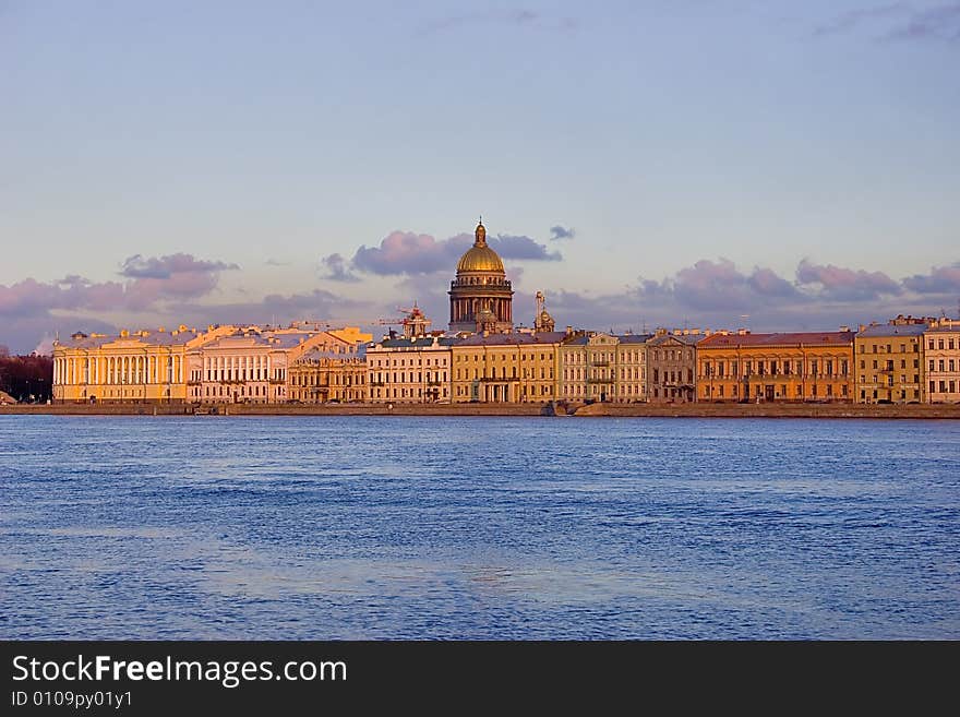 Sunset above Neva river and Isaak cathedral in Saint-Petersburg