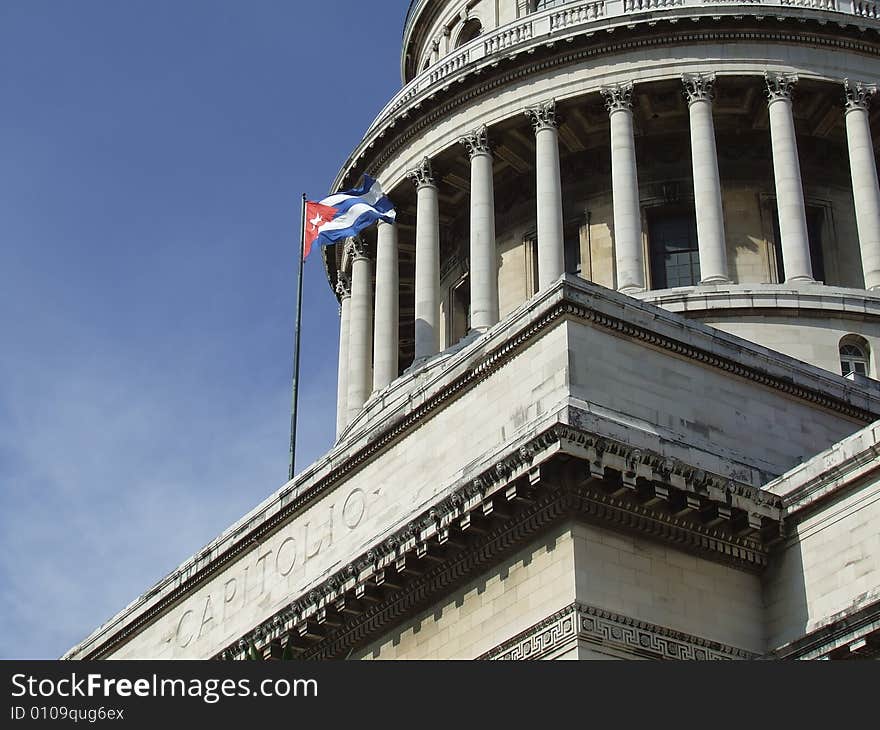 Havana s Capitol front corner and a flag