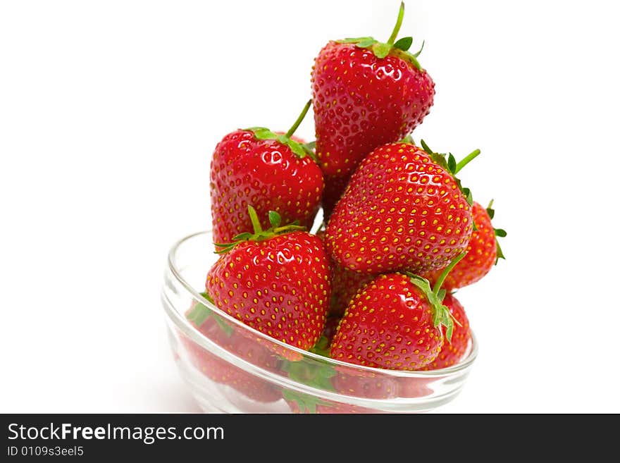 High key photo of fruit dish filled with nice red strawberries. High key photo of fruit dish filled with nice red strawberries