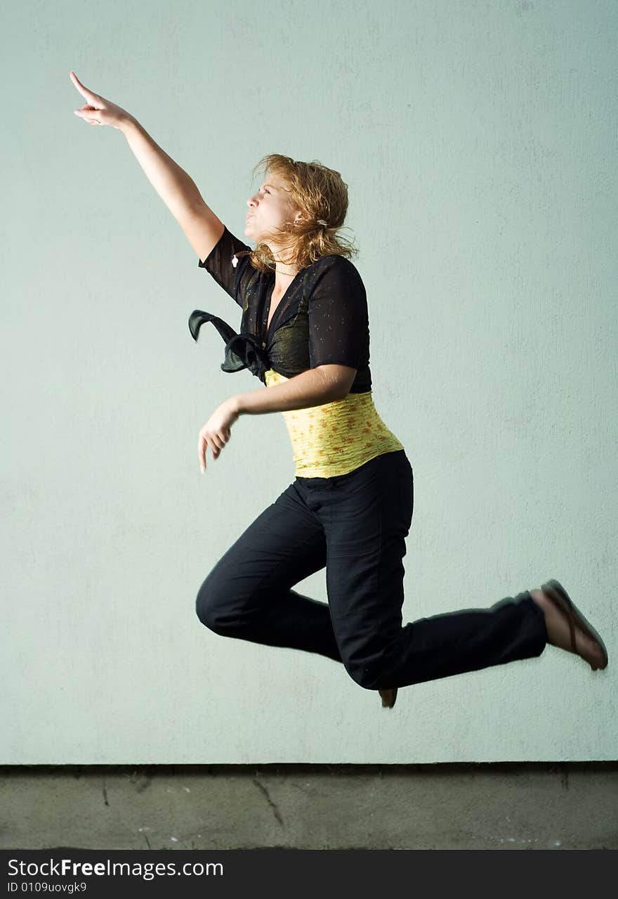 Jumping girl against the wall. Jumping girl against the wall.