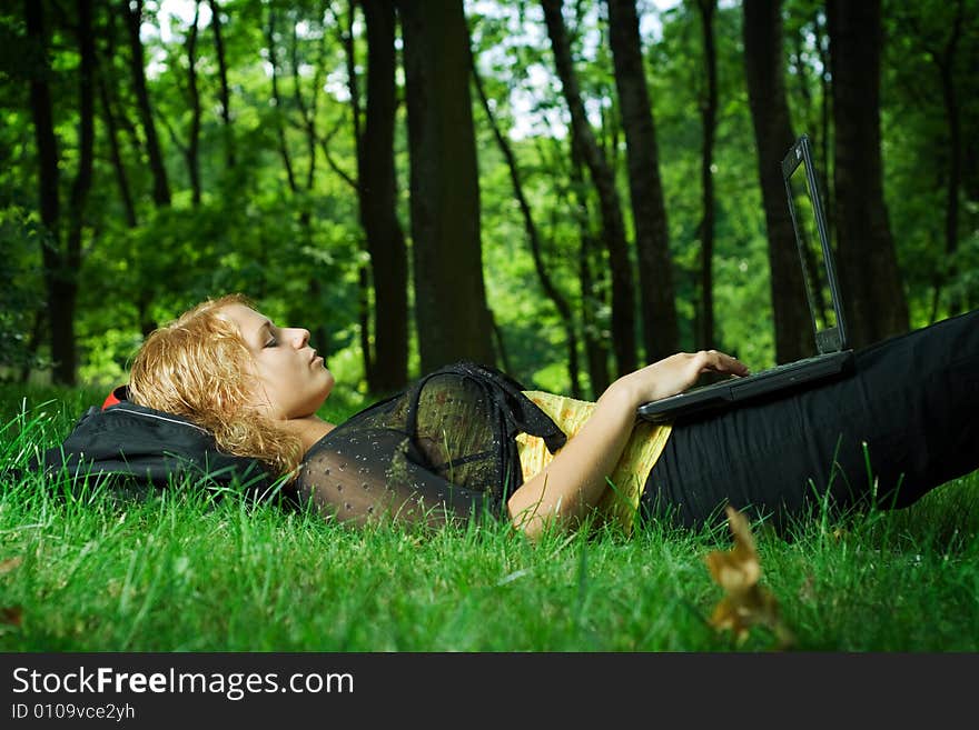 Student girl relaxing in the park. Student girl relaxing in the park.