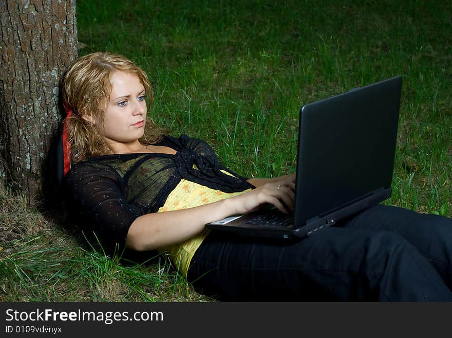 Student girl relaxing in the park. Student girl relaxing in the park.