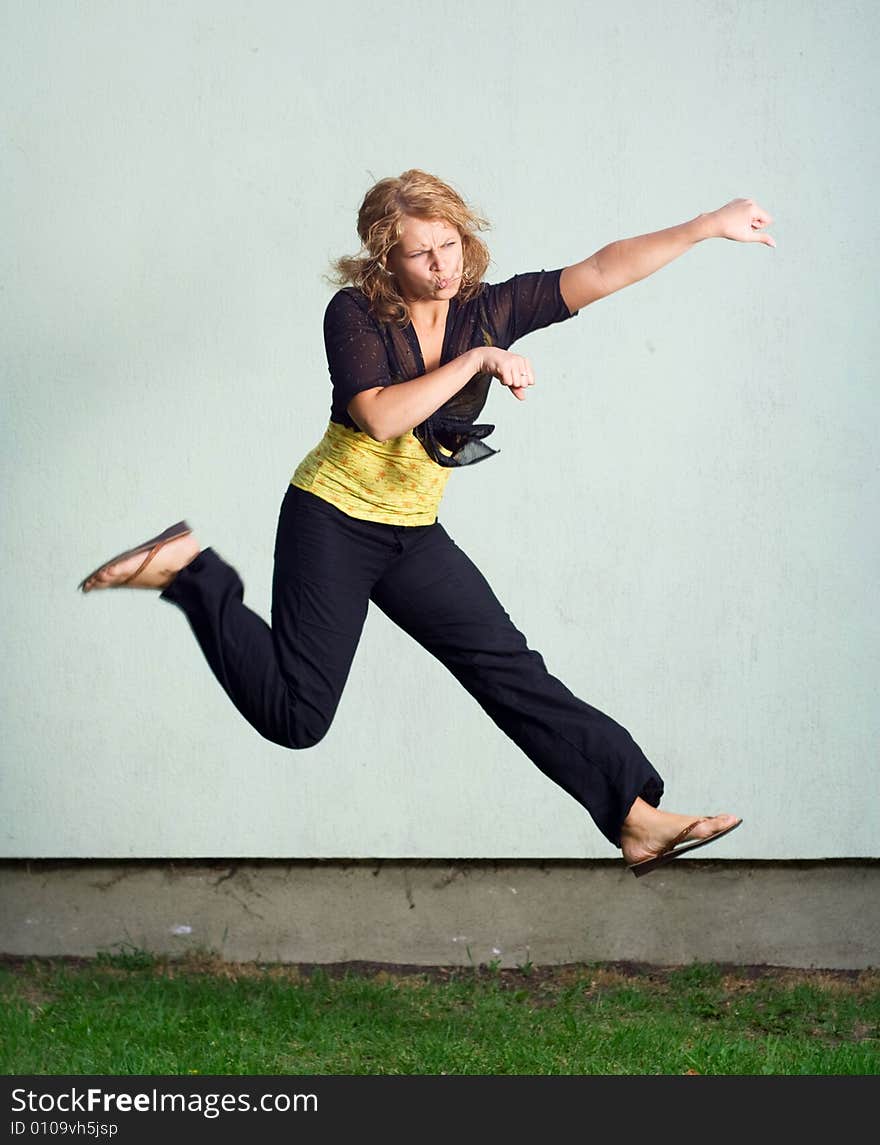 Jumping girl against the wall. Jumping girl against the wall.