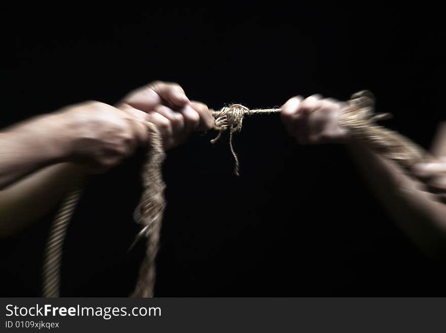 Photo of a rope with hand pulling