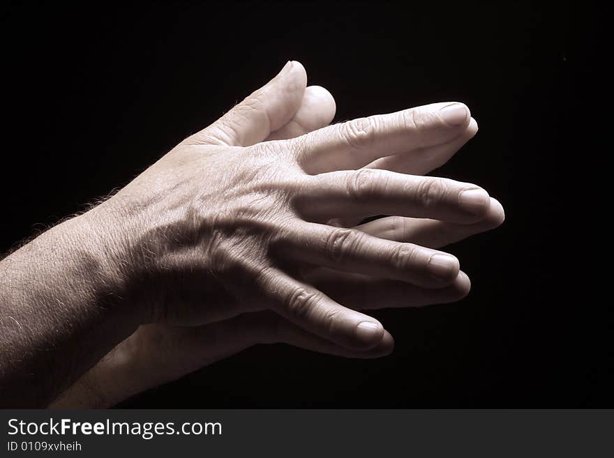 Photo of an old male hands on black. Photo of an old male hands on black