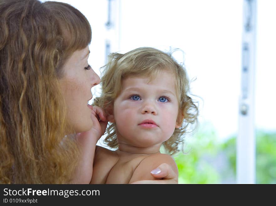 High key portrait of happy mother with baby. High key portrait of happy mother with baby