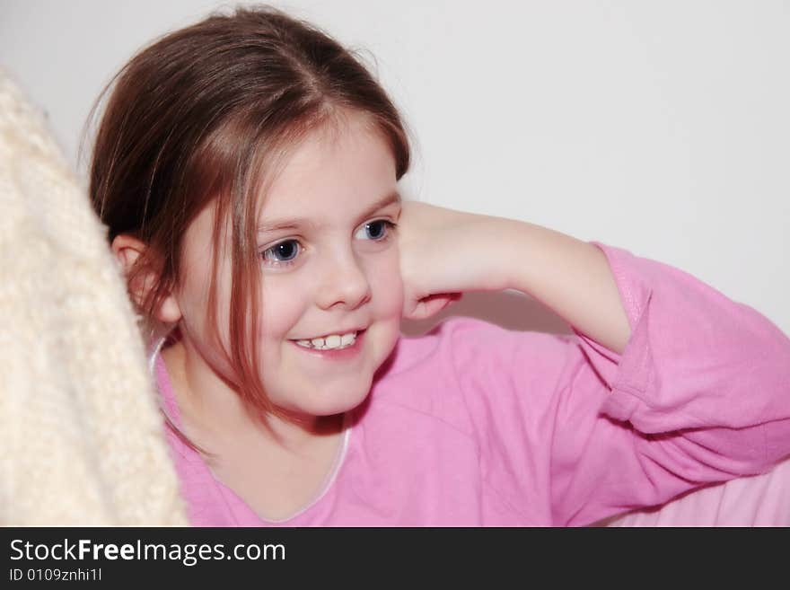 Girl smiling while looking happily into the distance. Girl smiling while looking happily into the distance