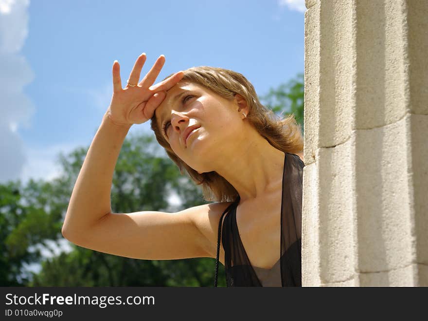 Attractive young woman looking at the top