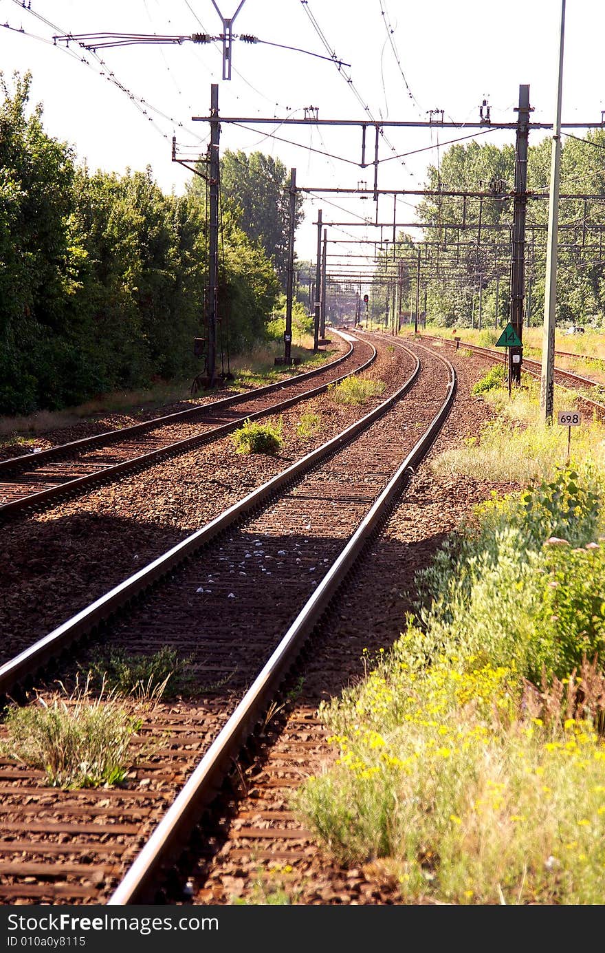 An empty rairoad ends at the horizon. An empty rairoad ends at the horizon