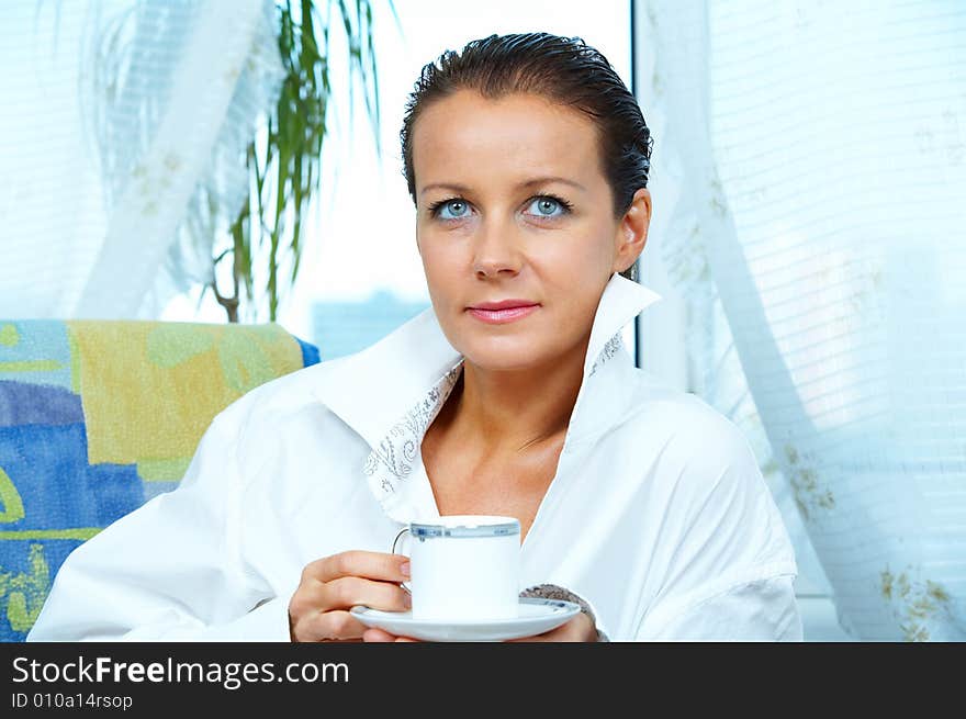 High key portrait of nice gorgeous woman drinking coffee. High key portrait of nice gorgeous woman drinking coffee