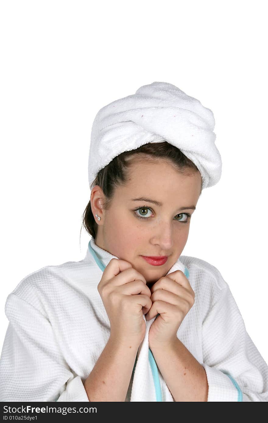 Serious teen in towel and robe