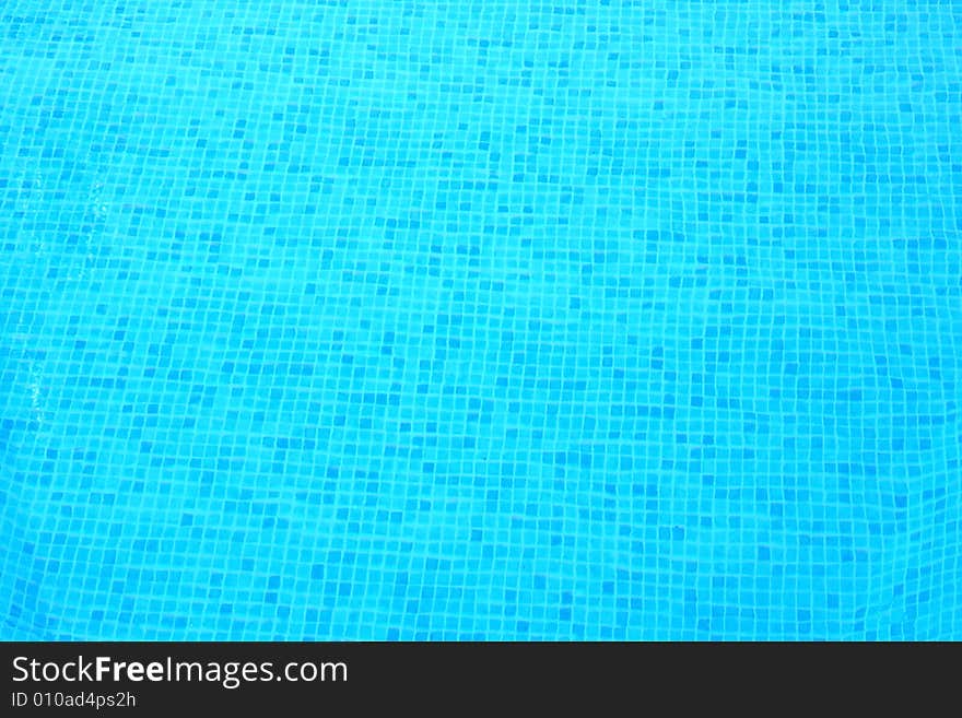 Blue transparent and clear water in swimming pool.