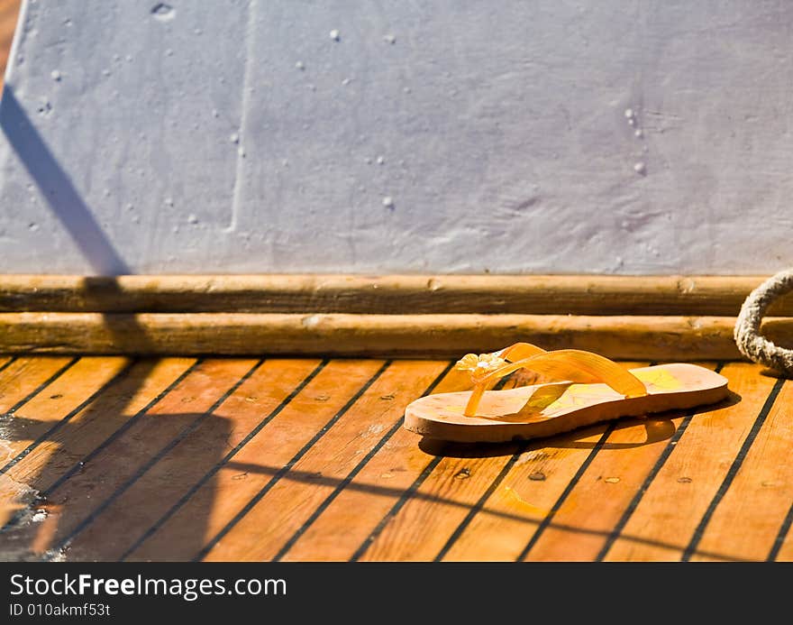 Summer series: yellow bedroom-slipper on the yach deck. Summer series: yellow bedroom-slipper on the yach deck