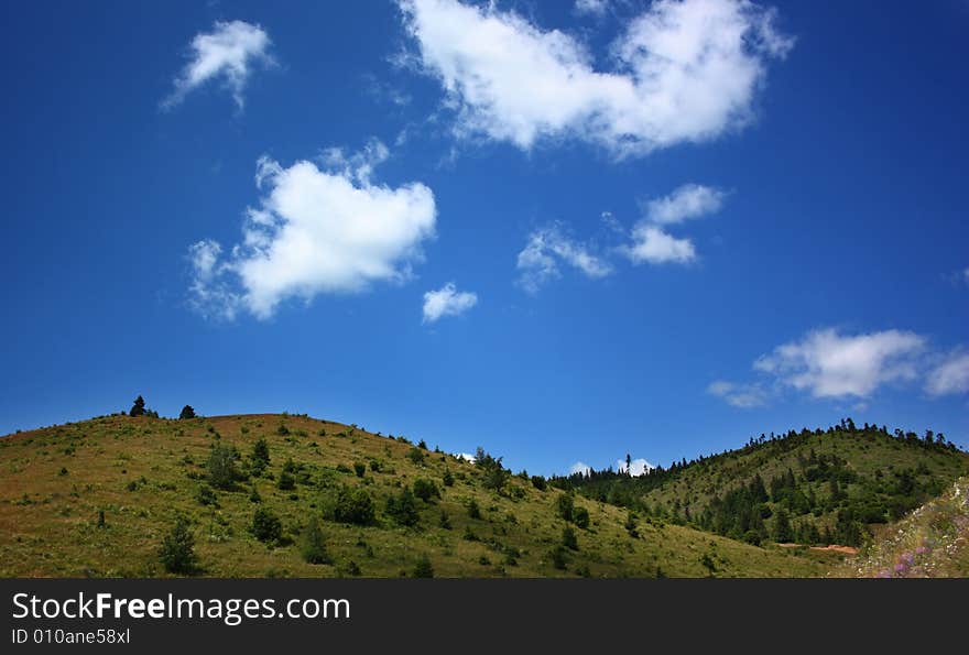 Green hills and blue sky