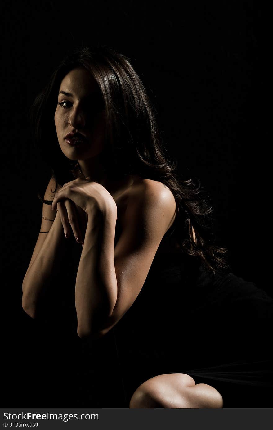 A young female model, photographed in the studio. A young female model, photographed in the studio.