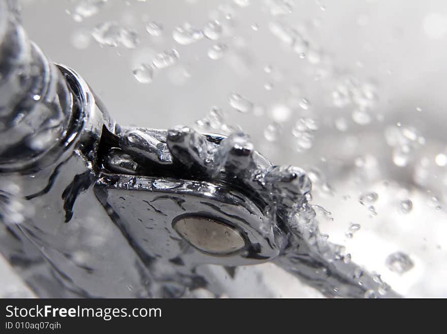 Water drops and corkscrew made from metal