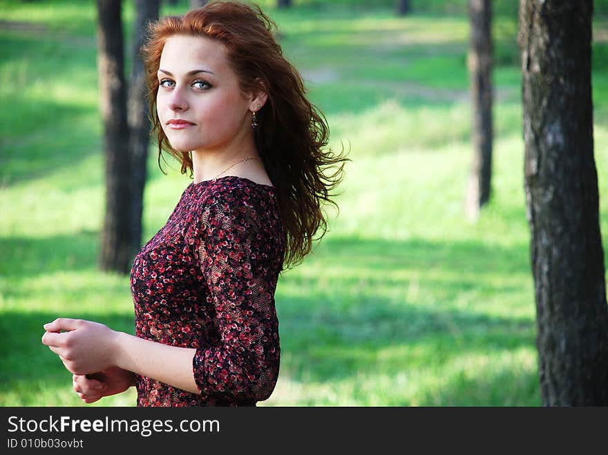 Portrait of beautiful girl, going for a walk in a garden among green trees. Portrait of beautiful girl, going for a walk in a garden among green trees