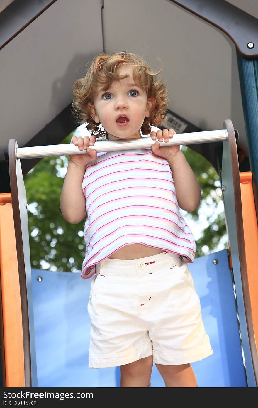 The child is perplexed by situation on the playground. The child is perplexed by situation on the playground.