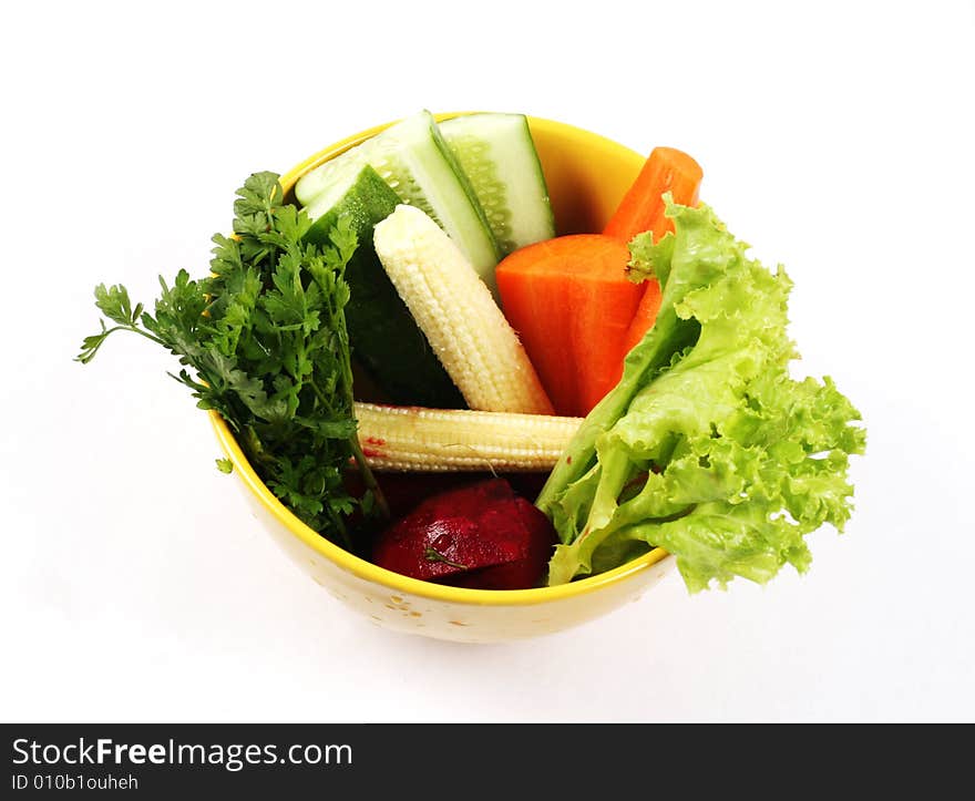 Bowl of fresh vegetables isolated on white. Bowl of fresh vegetables isolated on white.