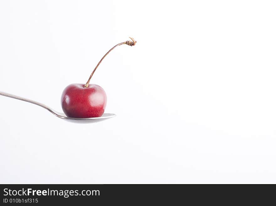 Cherry on spoon