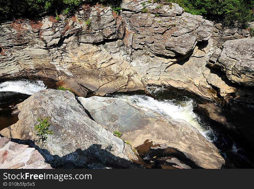 Red rocks in a mountain stream of fresh crystalline water. Red rocks in a mountain stream of fresh crystalline water