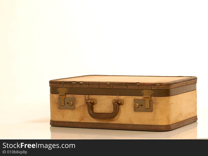 Brown vintage suitcase against white background