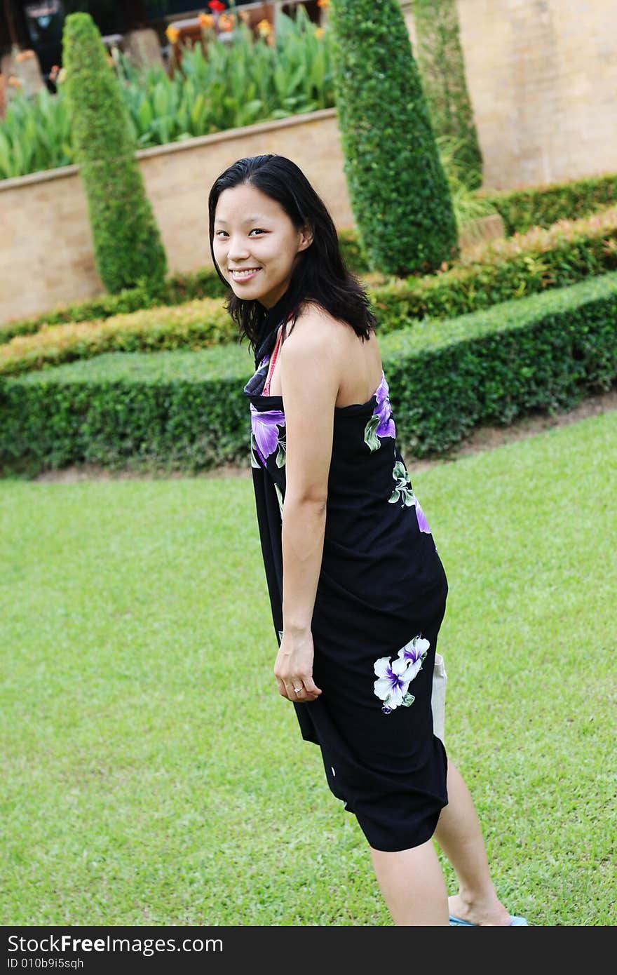 Portrait of a happy Korean woman dressed in a summer sarong. Portrait of a happy Korean woman dressed in a summer sarong.