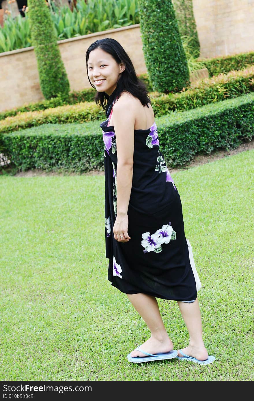 Portrait of a happy Korean woman dressed in a summer sarong.