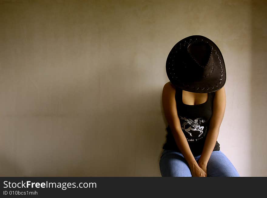 A Indian woman sitting in a room. A Indian woman sitting in a room