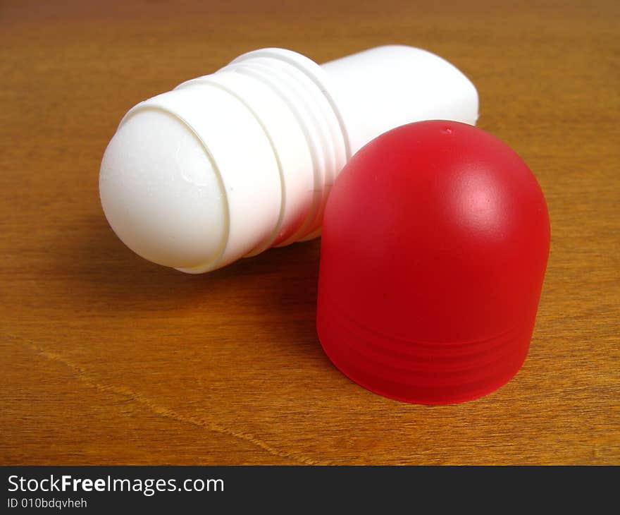 Mosquito repellent on a wood background