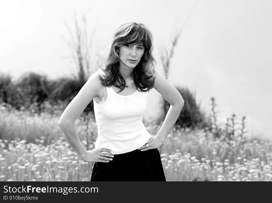 A beautiful girl walking near the lake. A beautiful girl walking near the lake