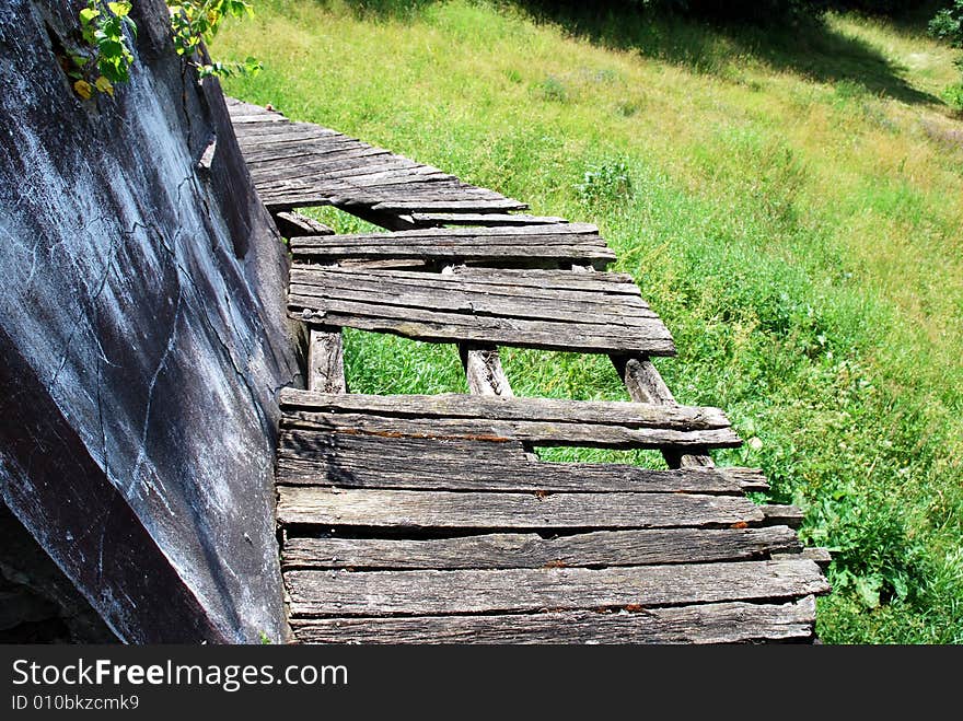 The old wooden and broken balcony