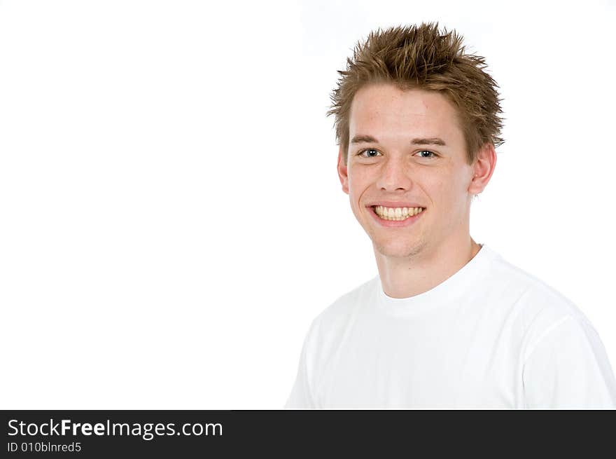 A handsome young man posing in the studio. A handsome young man posing in the studio