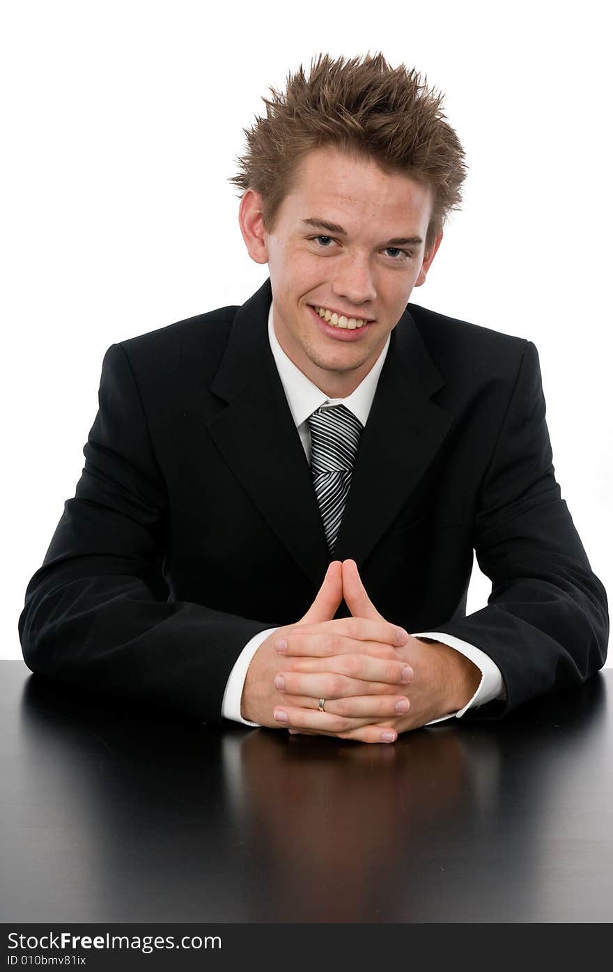 A young businessman sitting in his office