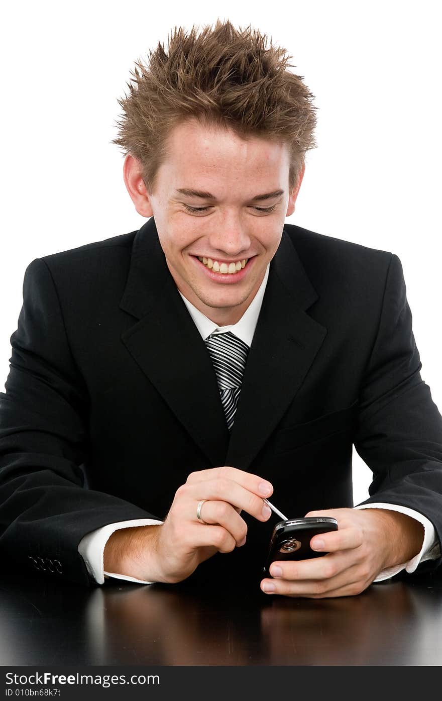 A young businessman on the phone in his office