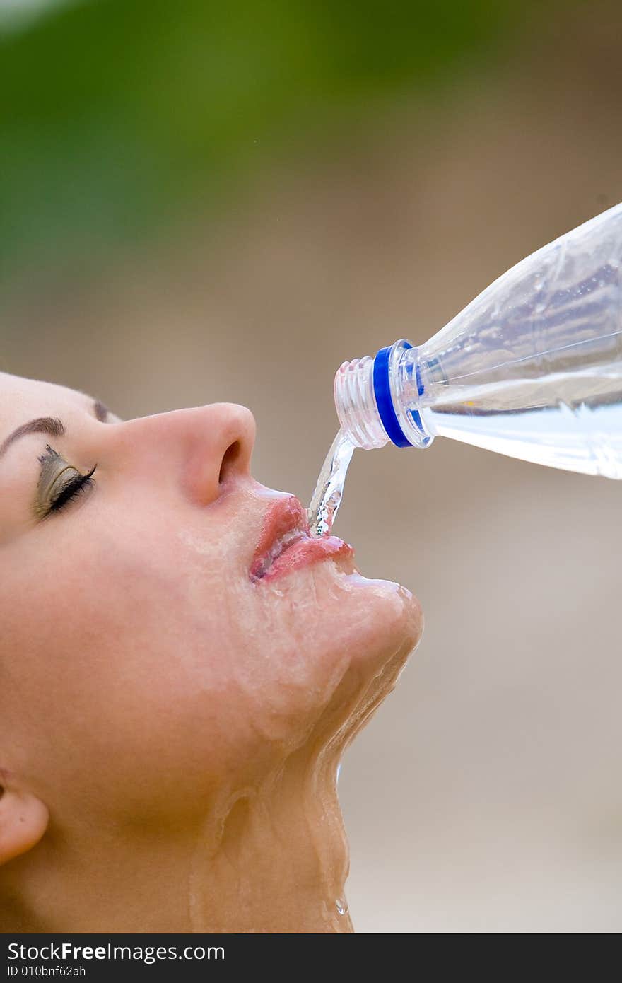 Beautiful Girl Drinking Clear Water