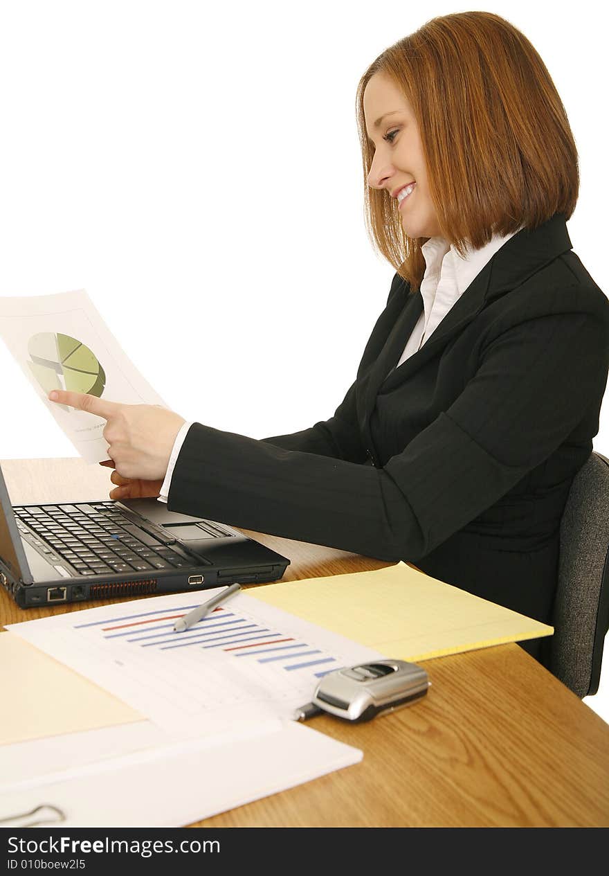 Young business woman on sitting down, working on her table. Young business woman on sitting down, working on her table