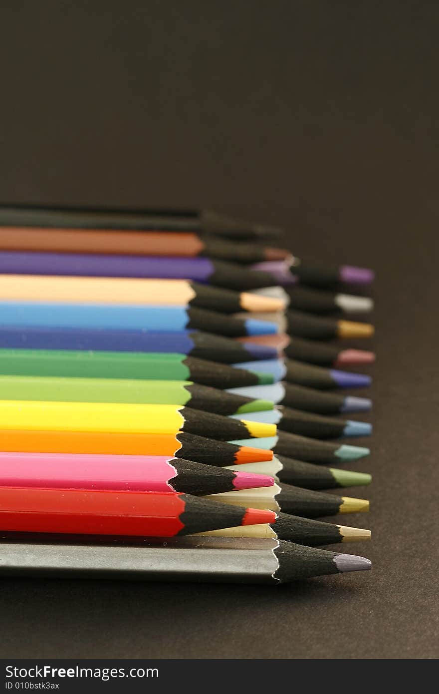 Colors pencils in a simple blackcolor background. Colors pencils in a simple blackcolor background