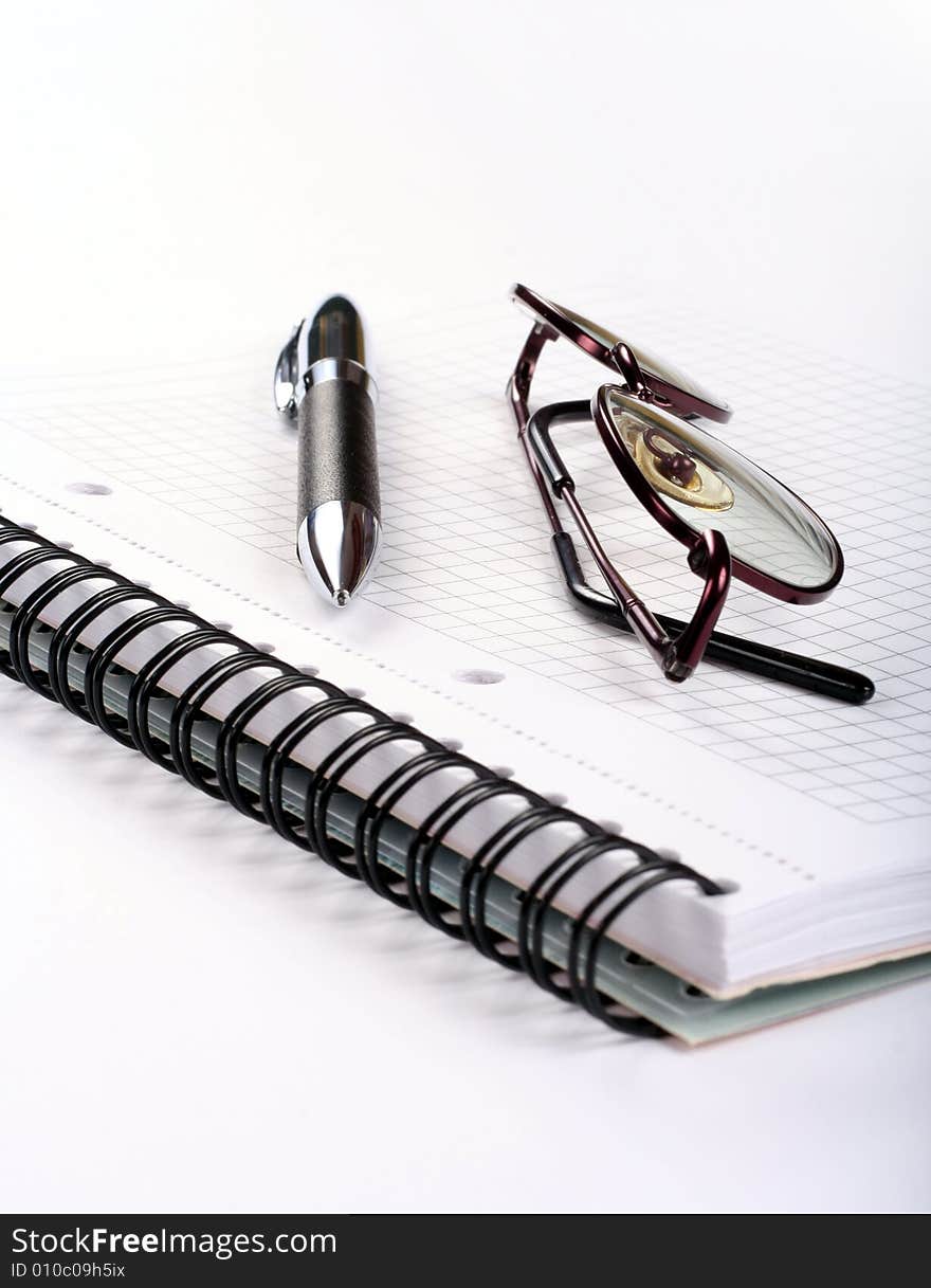 Notepad With Eyeglasses And Pen