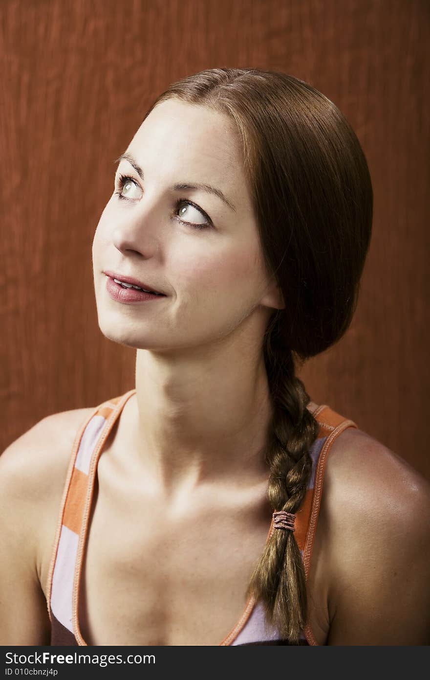 Closeup Portrait of an Attractive Young Woman Looking Up